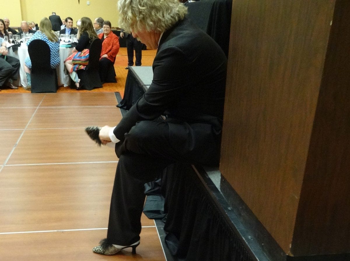 Monty Dixon putting shoes on